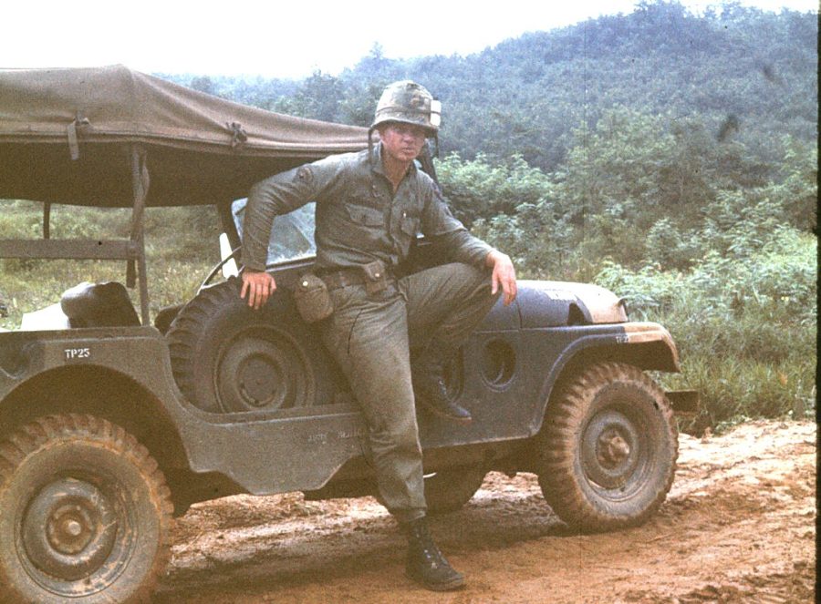 Mr. Easter posed by the Jeep he drove around Korea. Photo courtesy of Mr. Easter