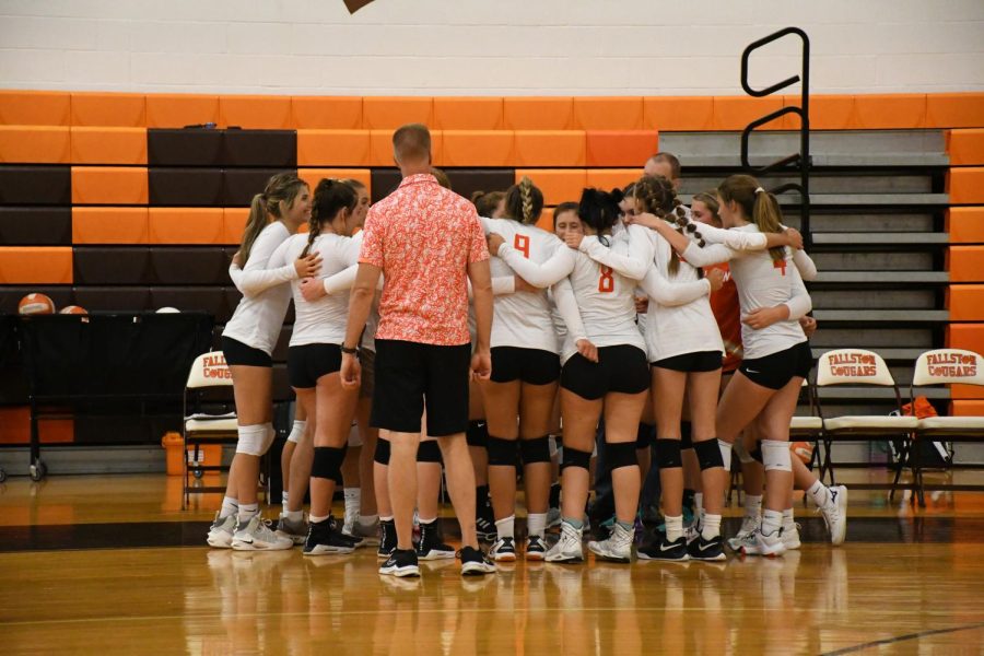 Huddles, hugs, hard work! Pictured here is the Women’s Varsity team before the first official game of the season. Photo Courtesy of Renae Gent 