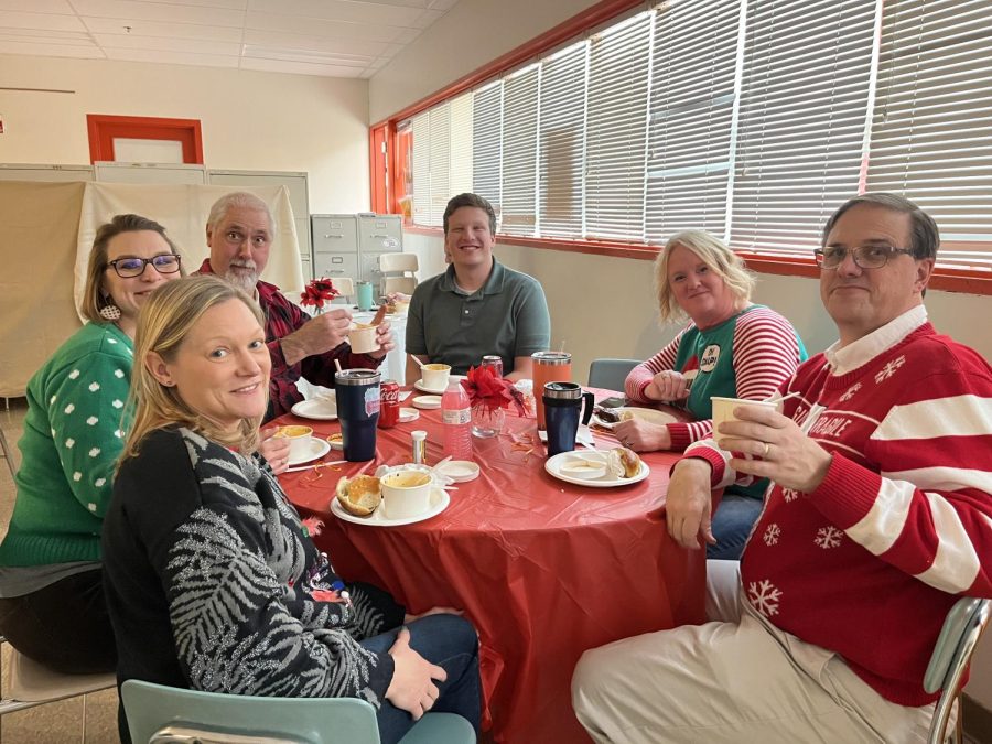 The science department gathered together enjoying their homemade meal! Pictured from clockwise around: Mrs. Guest, Mrs. Saxon, Mr. Taylor, Mr. Houck, Mrs. 		Cummings, and Mr. White. Photo Courtesy of: Kelli McGee