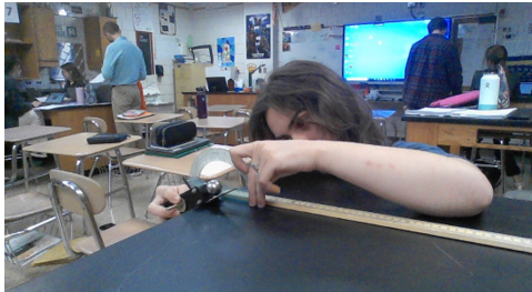  Gabbi Wade measuring the angle for the angle projection lab! Its all focus in this picture but in the class its all fun!