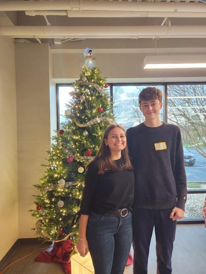 Lena (left) and Anton (right) are featured in front of a Christmas tree at an ASSE potluck where all of the exchange students in Maryland shared presentations about their home countries. Photo Courtesy of Lena Wurz. 