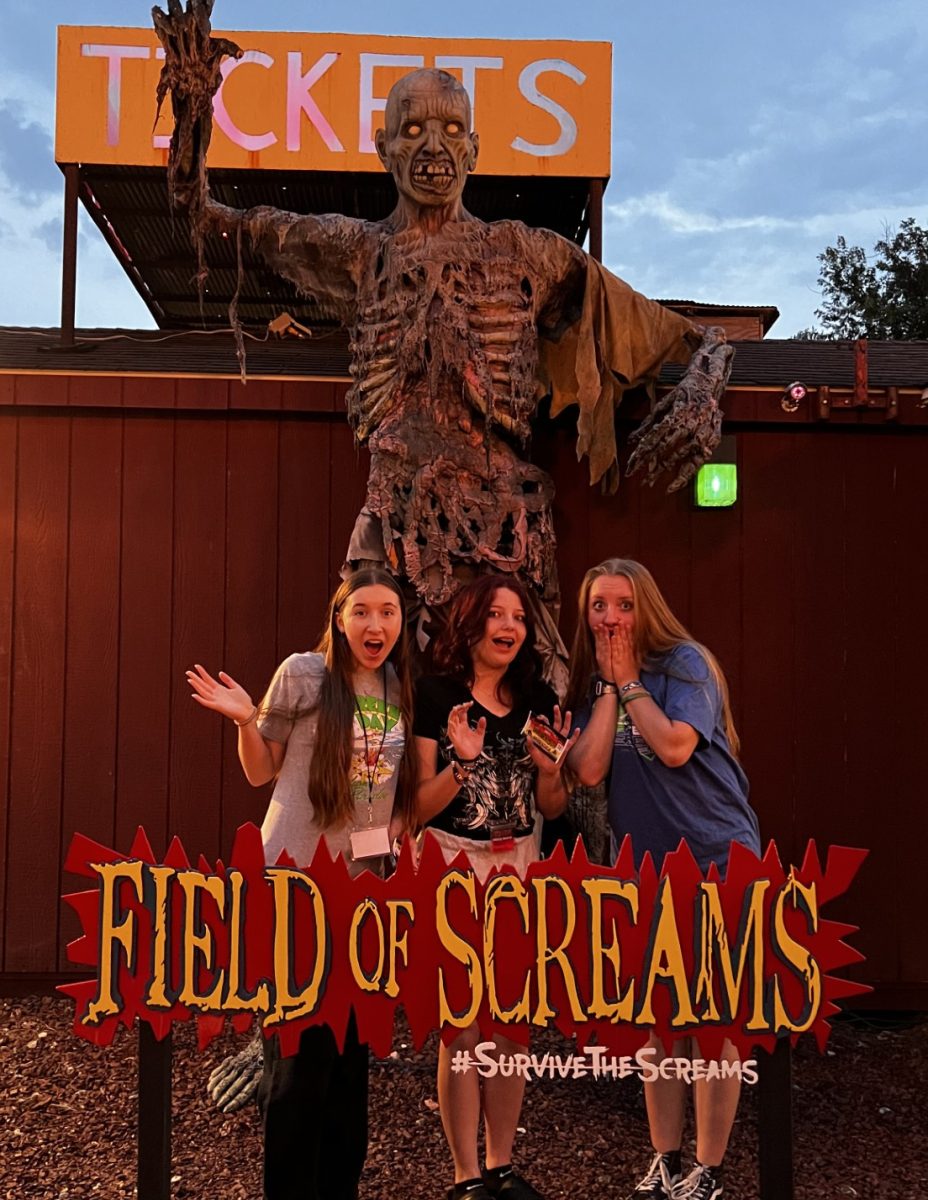 Pictured above are Kaitlyn Hughes, Emma Nigro, and Bryah Dilley at the sign located in Field of Screams. (Photo Courtesy of Samantha Brown) 