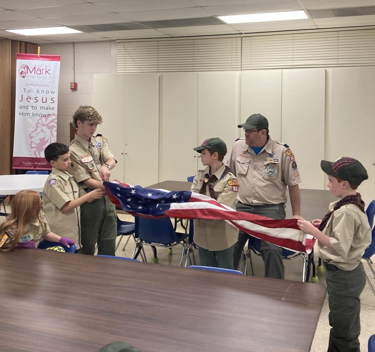 Nate+showing+future+eagle+scouts+how+to+fold+the+American+flag.+%28Photo+Courtesy+of+Ms.+Grant%29