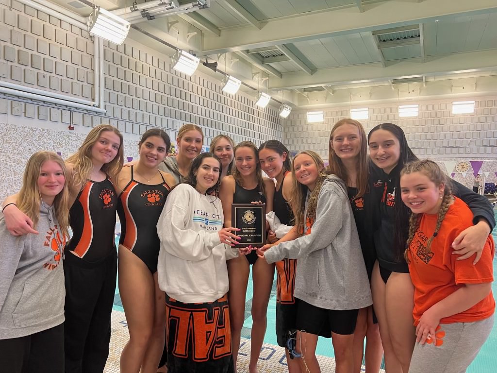 Womens Swim posed with their plaque after the big win. (Photo Courtesy of Addy Rebasti)