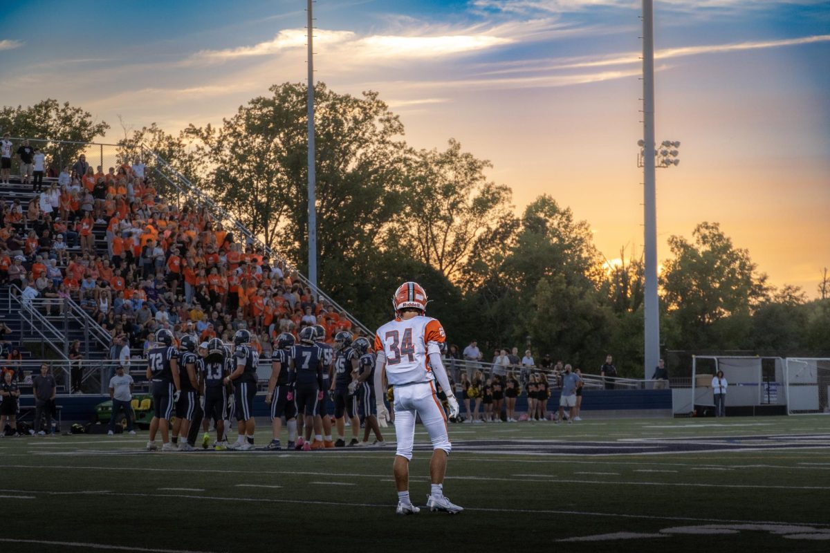 Senior DB Aiden Fodel looks on toward the Bel Air huddle in Fallston's narrow loss 27-20 on Friday, September 6th, 2024. 
Photo Courtesy of Joseph Mullen 