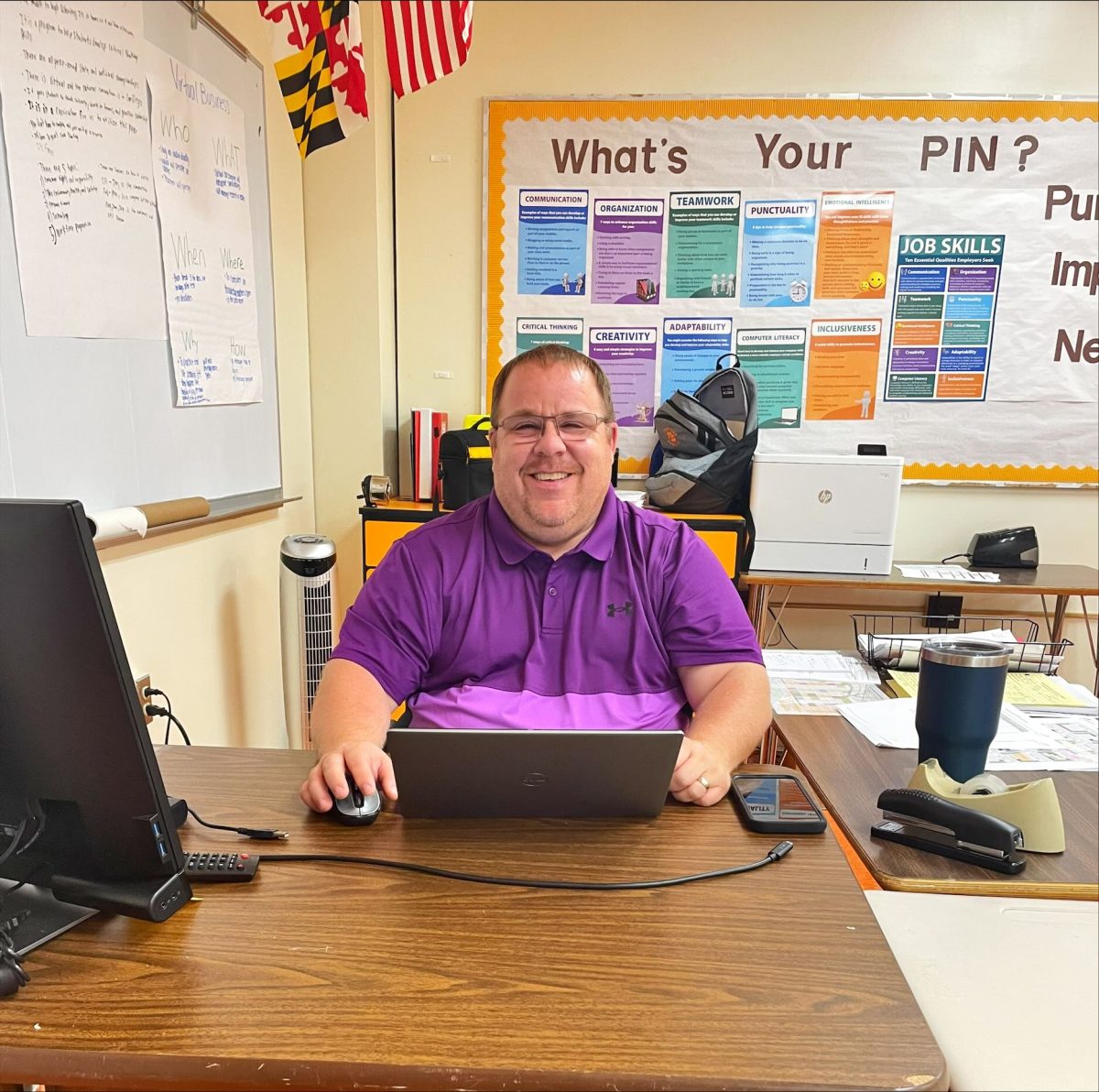 Mr. Bellamy at his desk doing some “serious business work.”  (Photo Courtesy: Bryah Dilley)