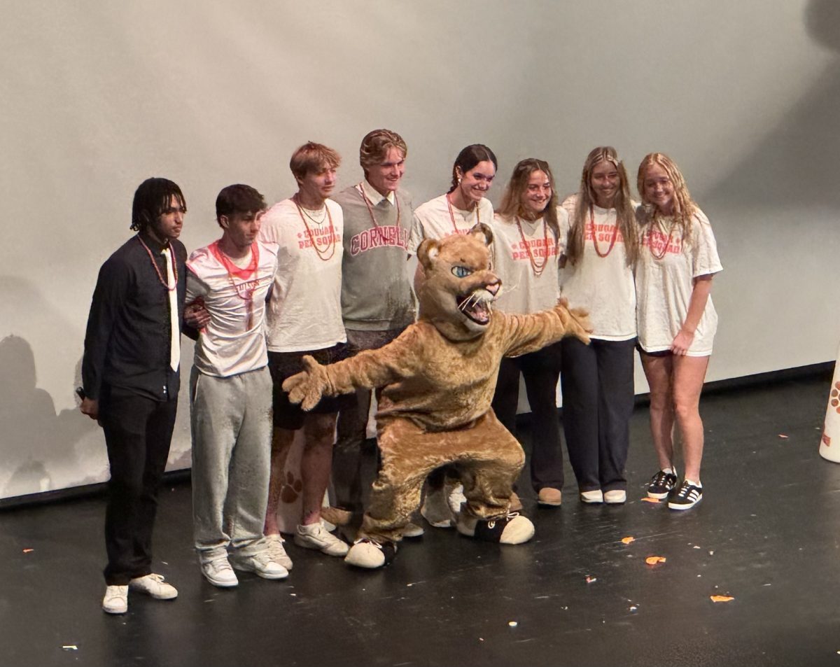 Fallston Pep Squad members pictured from left to right: Dom Witherspoon, Dom Foster, Ian Swartzendruber, Gordon Lefkowitz, Natalie Wirth, Sydney Grafton, Sarah Gent, and Ella Litz, with Gar front and center. (Photo courtesy of Ella Colburn) 