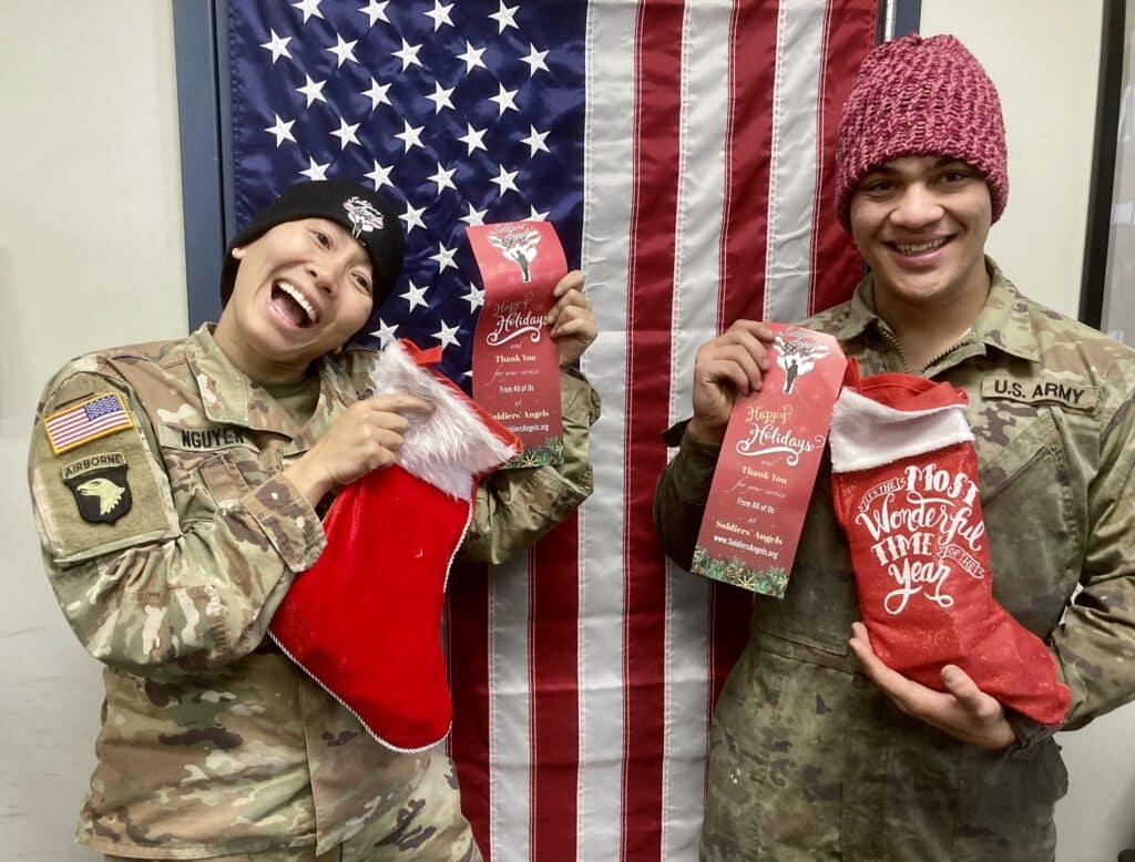 Soldiers with their holiday stockings. Photo Courtesy of Soldiers’ Angels.