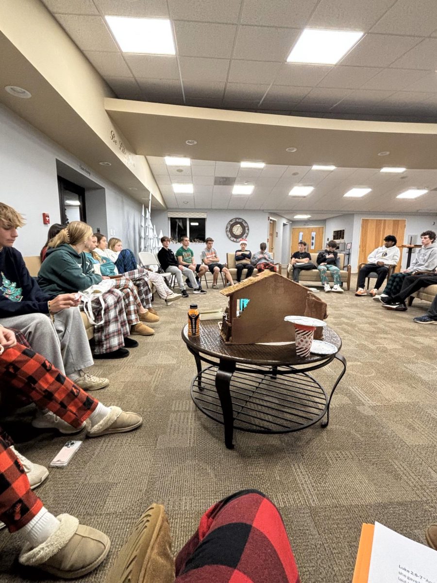 Students gather around to finish their Bible study in a big group discussion of their final thoughts. Photo Courtesy of Olivia Rotella. 