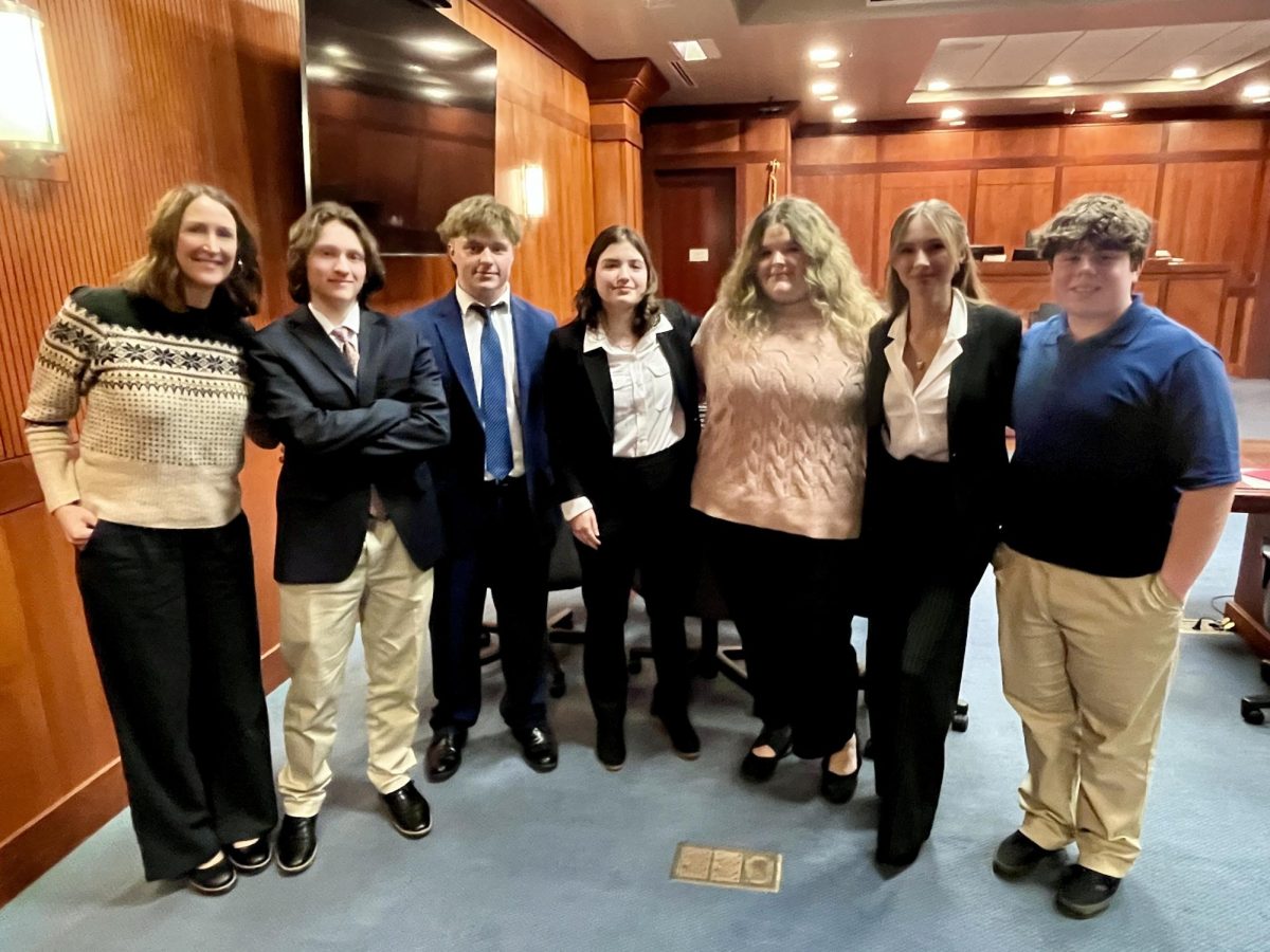 Pictured from left to right are a few of Mock Trial’s amazing students and advisor: Mrs. King, Mark Zaranski, Cole McCumbers, Sammie Evans, Anna Newman, Ella Schmidt, and Joe Reinhardt. Photo courtesy of Mrs. Alyssa King.