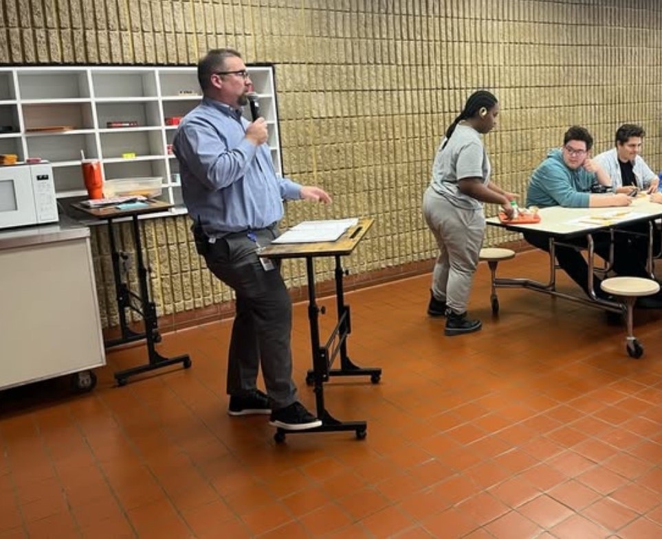 Mr. Milanoski reads off another trivia question as students prepare to compete. (Photo courtesy of @fallstonhs on Instagram)