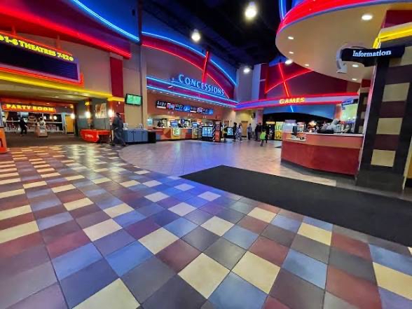 A throwback picture of a Regal Cinemas movie theater gives you the nostalgia of movie theaters in just one image. The bright colorful lights, checkered floors, and youthful layout automatically give you the feeling of being a kid in a movie theater again. Photo Courtesy of Reddit. 
