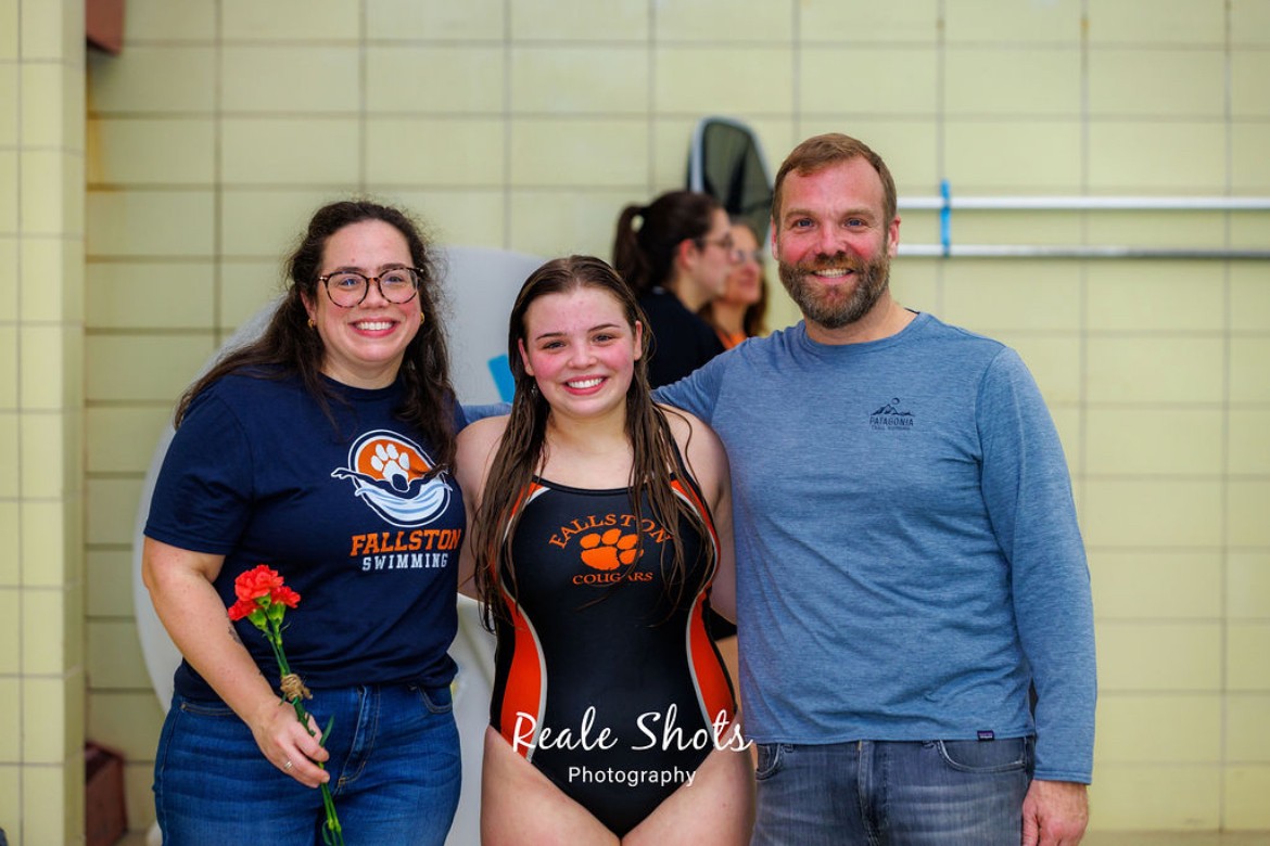 Maddy Burch posed with her parents Jenn Burch and Graham Burch for a Senior Night swim meet photo against Aberdeen, this is her fourth and final year with the Fallston Swim Team. Photo Courtesy: Tim Montoya/ Reale Shots Photography