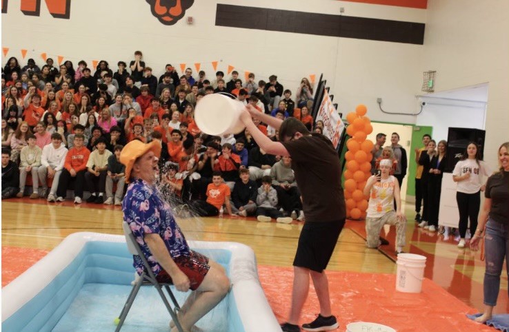 Science teacher, Mr. White, was doused in freezing cold water during Fallston's winter pep rally. Photo Courtesy of Reagan Stevens.