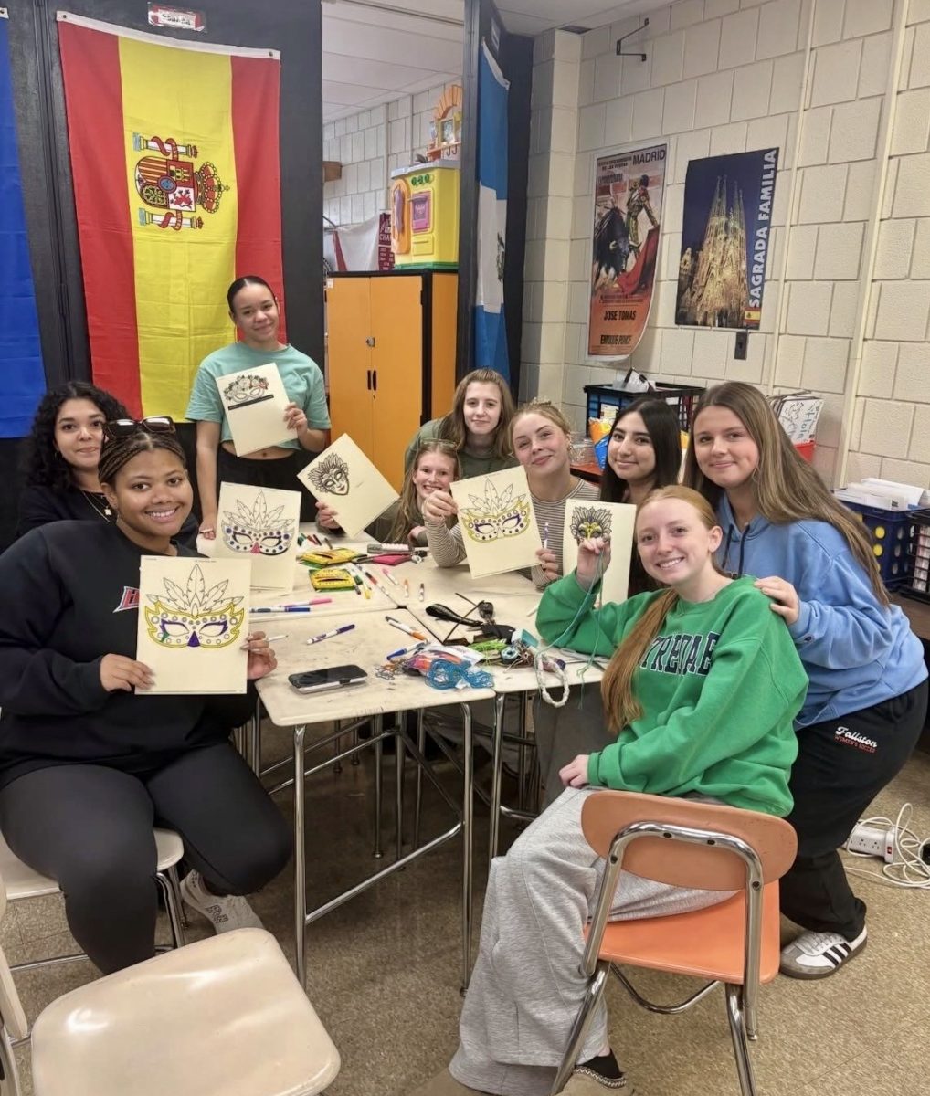 Spanish club members hard at work making their masks as vibrant as possible. Photo courtesy of Maddie Morehead.