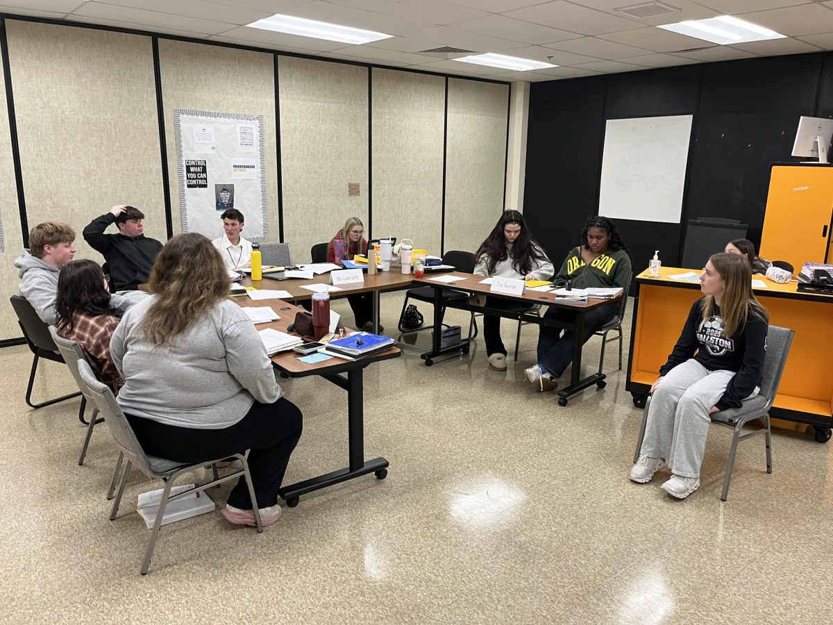 The Mock Trial team hard at work, as they sharpen their arguments and better understand the fine details of the case. Photo Courtesy of Alyssa King.